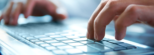 Close-up of typing male hands